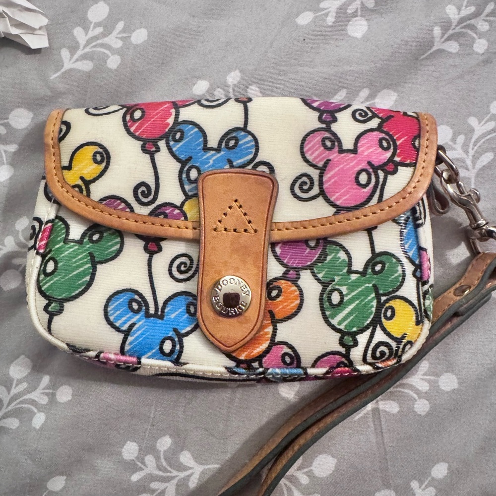 Dooney & Bourke Walt Disney World Mickey balloon pattern wristlet.